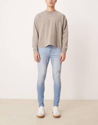 ASOS DESIGN power stretch jeans in light wash-Blue