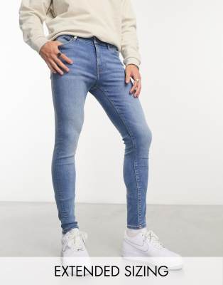 power stretch jeans in mid wash blue