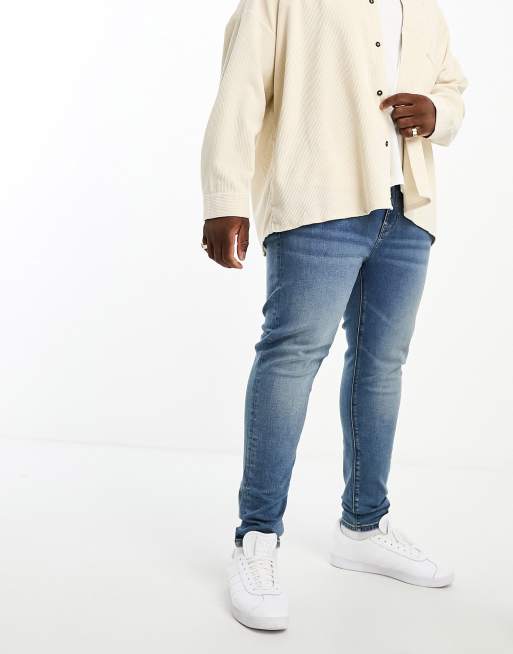 ASOS DESIGN power stretch jeans in mid wash blue