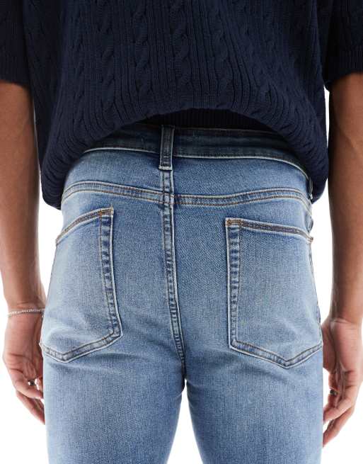 ASOS DESIGN power stretch jeans in mid wash blue