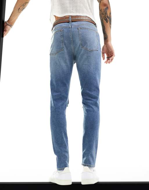 ASOS DESIGN power stretch jeans with all over rips in light wash blue, 2 of 6