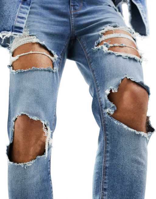 ASOS DESIGN power stretch jeans with all over rips in light wash blue, 3 of 6