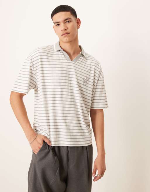 ASOS DESIGN – Prążkowana koszulka polo oversize o pudełkowym kroju w niebiesko-białe paski z logo na piersi