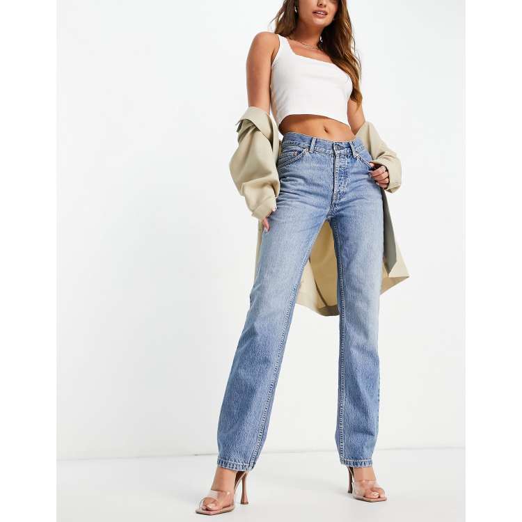 ASOS DESIGN mid rise comfort stretch straight leg jeans in midwash