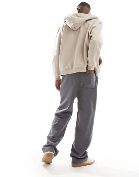 ASOS DESIGN – Premium – Jogginghose in Anthrazit mit erhöhtem Print und weitem Bein - view 1
