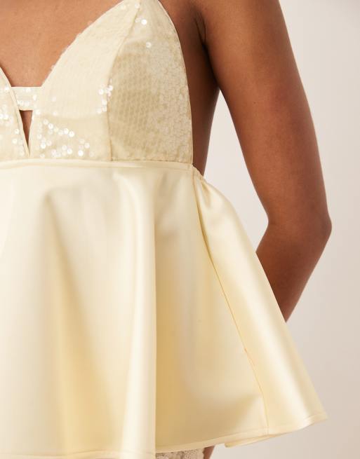 ASOS Design Premium sequin bust cami with satin peplum hem in lemon yellow