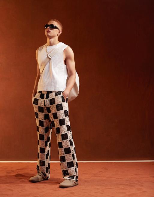 ASOS DESIGN Premium – Szydełkowane teksturowane spodnie plażowe z szerokimi nogawkami i elastyczną talią w kolorze czarnym i białym