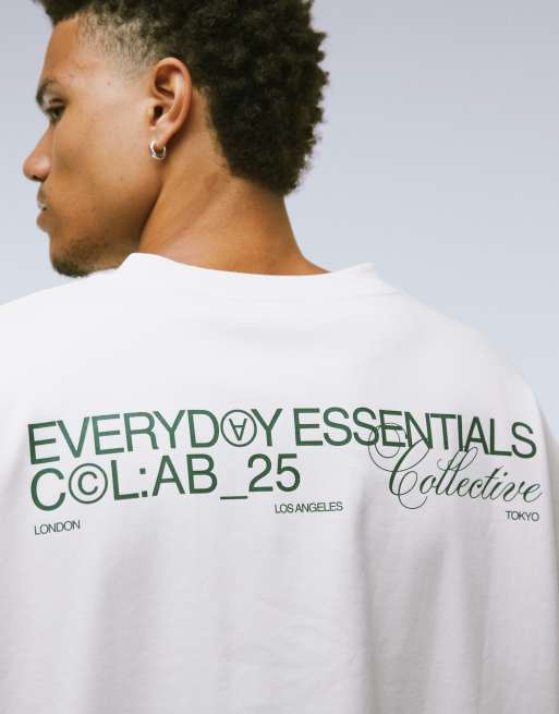 ASOS DESIGN - Premium T-shirt van superzware stof met lange mouwen, verlaagde schouders en grafische tekstprint in wit