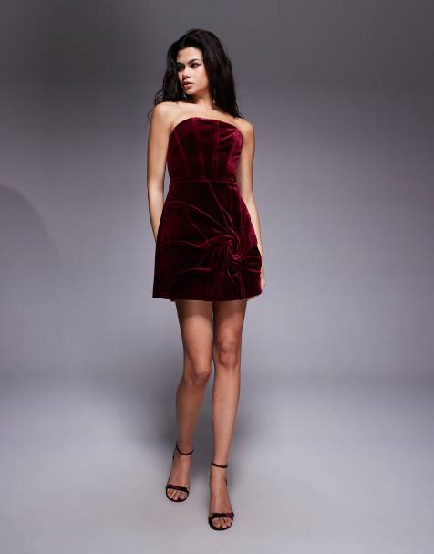 ASOS DESIGN Premium velvet bandeau corseted mini dress with ruched flower illusion in burgundy - view 1