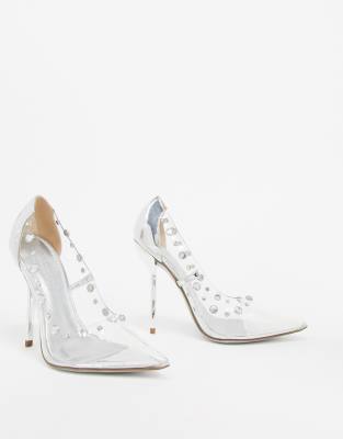 silver and clear pumps