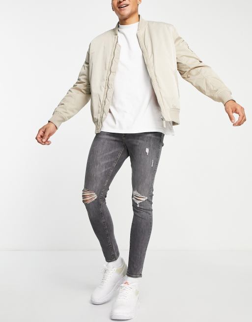 ASOS DESIGN – Przylegające jeansy ze stretchem w kolorze spranej czerni z rozcięciami na kolanach