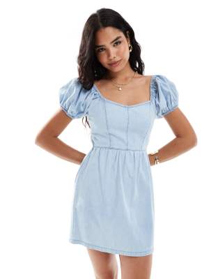 puff sleeve denim mini dress with cross back detail in light blue