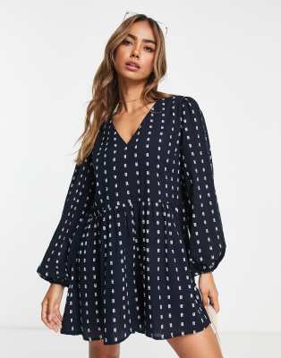 ASOS DESIGN puff sleeve smock playsuit in textured navy | ASOS