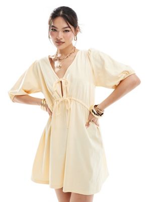 Asos Design Puff Sleeve With Tie Up Bodice Mini Dress In Buttermilk-yellow