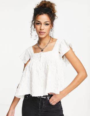 ASOS DESIGN puff textured button through ruffle sun top in ivory-White