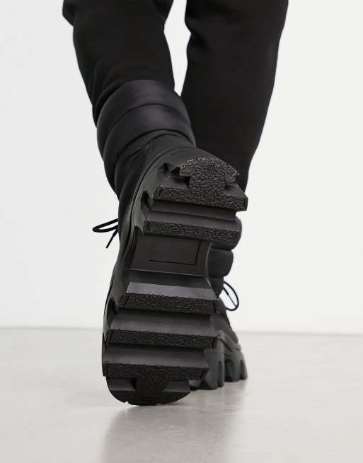 ASOS DESIGN lace up boot with chunky sole and studded strapping in