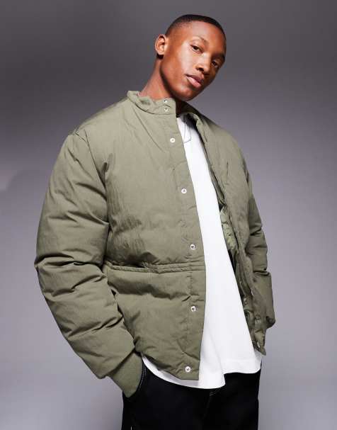 ASOS DESIGN puffer jacket with concealed pockets and rib cuffs in green - view 1