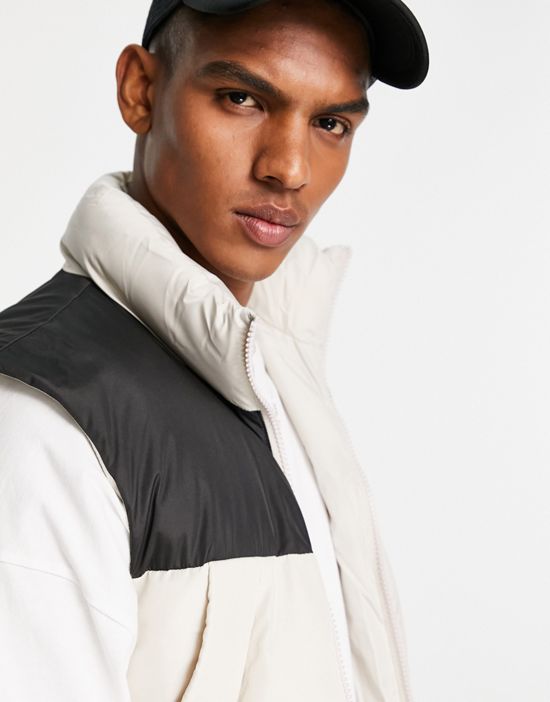 https://images.asos-media.com/products/asos-design-puffer-vest-in-stone-with-contrast-black-yoke/201504505-2?$n_550w$&wid=550&fit=constrain