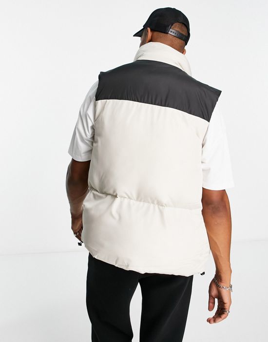 https://images.asos-media.com/products/asos-design-puffer-vest-in-stone-with-contrast-black-yoke/201504505-4?$n_550w$&wid=550&fit=constrain