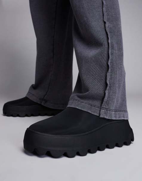 ASOS DESIGN pull on boots in black with chunky sole - view 1