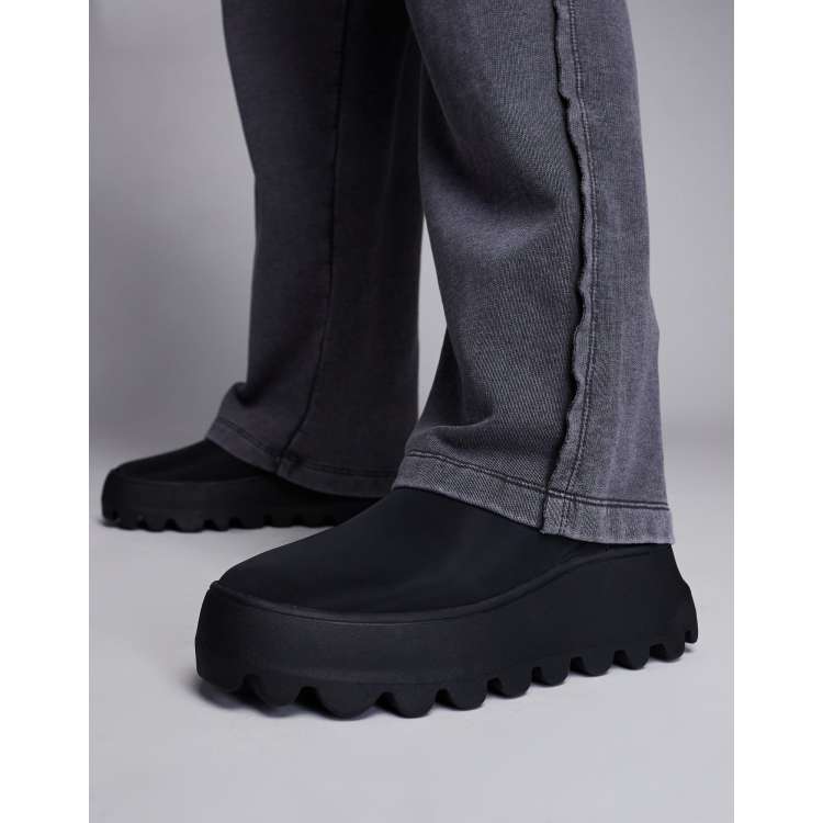 ASOS DESIGN pull on boots in black with chunky sole ASOS