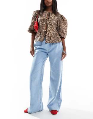 Asos Design Pull On Flare Jeans In Mid Blue