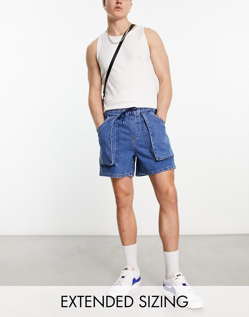 ASOS DESIGN pull on mid length denim shorts with cargo pockets in mid wash blue