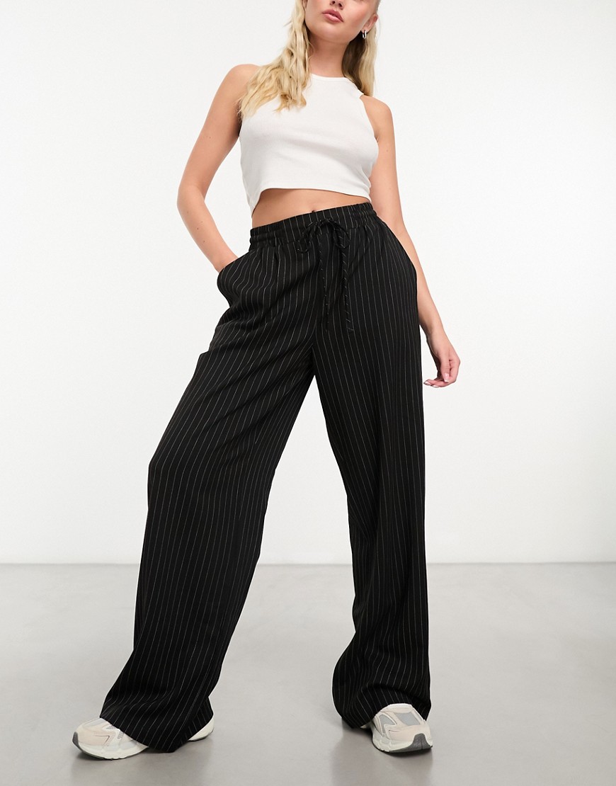 pull on pants in black with white stripe
