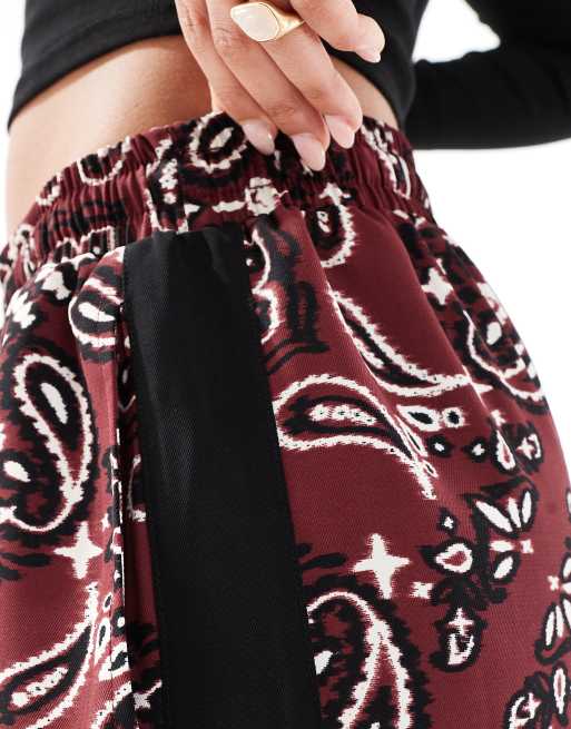 ASOS DESIGN pull on pants with contrast panel in dark cherry bandana print