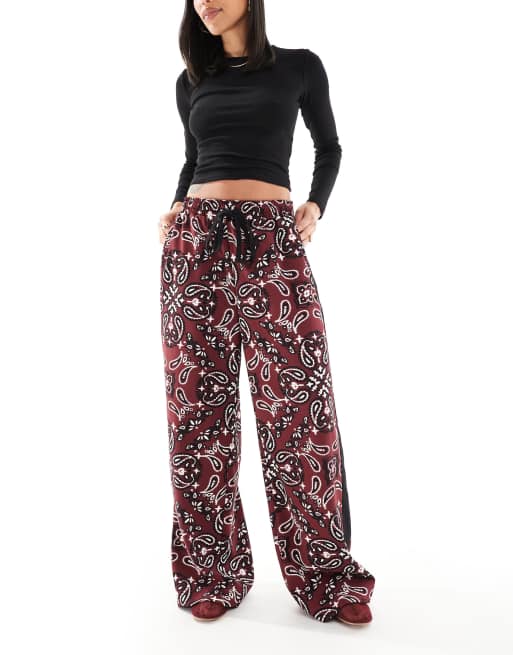 ASOS DESIGN pull on pants with contrast panel in dark cherry bandana print