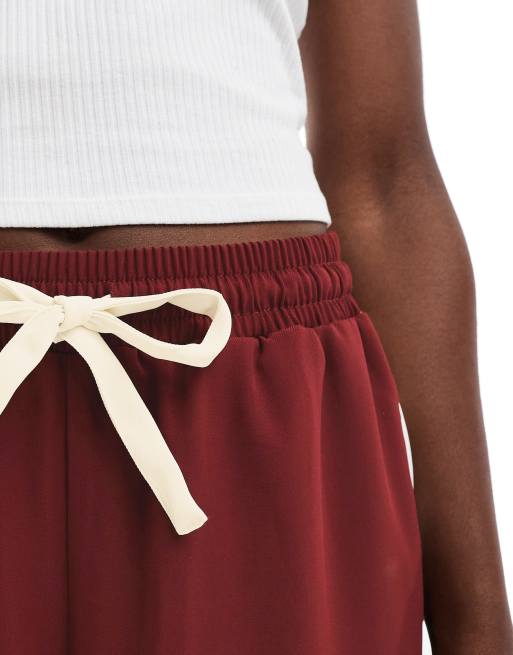 ASOS DESIGN pull on pants with contrast panel in burgundy