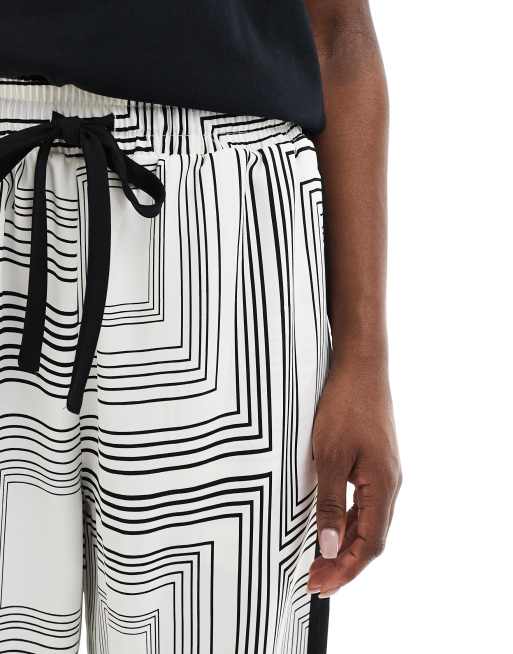 ASOS DESIGN pull on pants with contrast panel in geo mono
