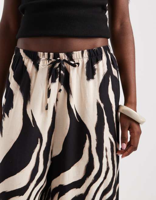 ASOS DESIGN pull on pants with frill hem in animal print, 3 of 5