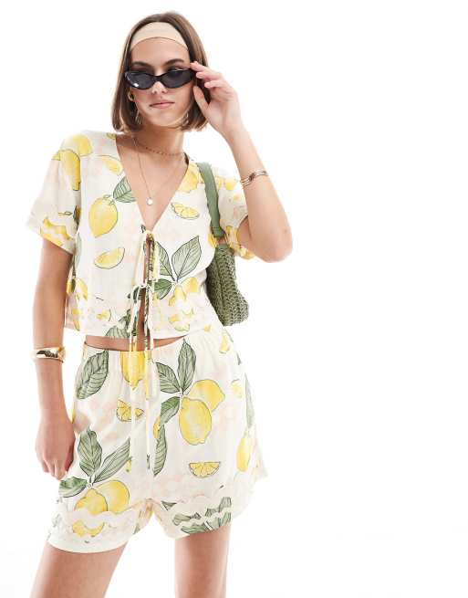 ASOS DESIGN pull on shorts with rik rak trim in lemon print