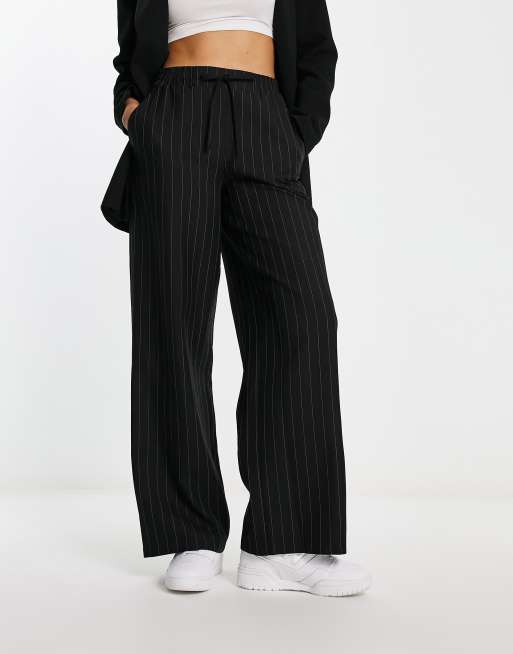 Black trousers with store stripe down side