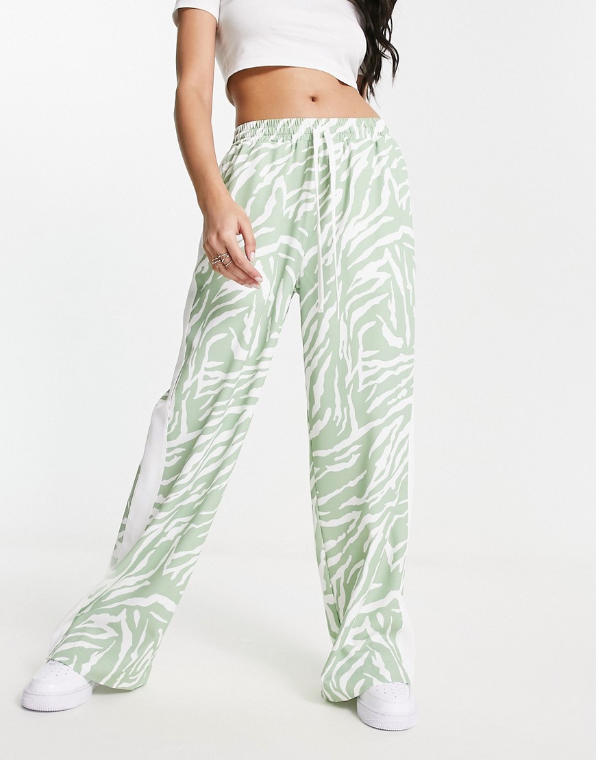 ASOS DESIGN pull on trouser with contrast panel in animal print in sage-Blue