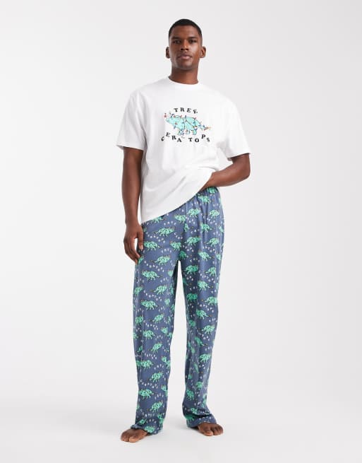 ASOS DESIGN pyjama set with Christmas dinosaur graphic in blue
