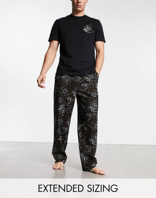 ASOS DESIGN pyjama set with t-shirt and pants in black with space print