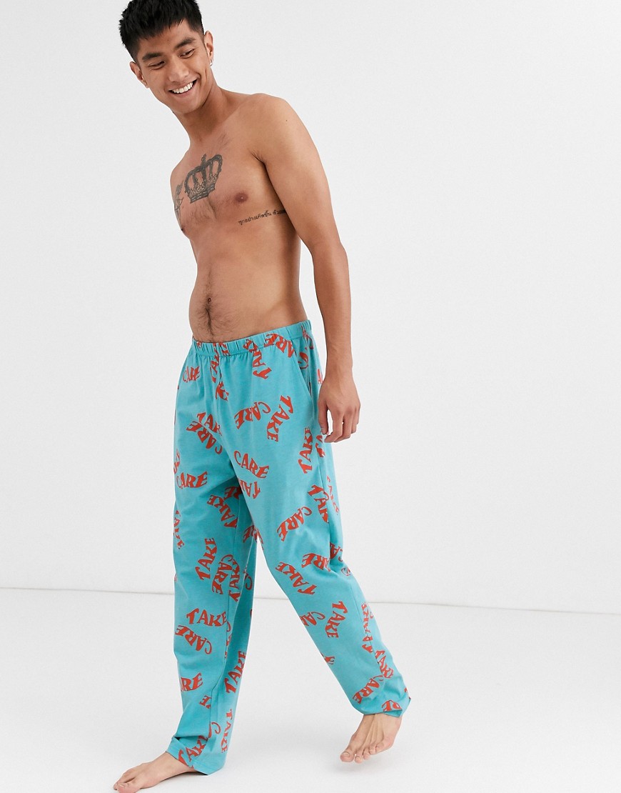 ASOS DESIGN - Pyjamabroek met 'Take care'-print in blauwgroen-Multi