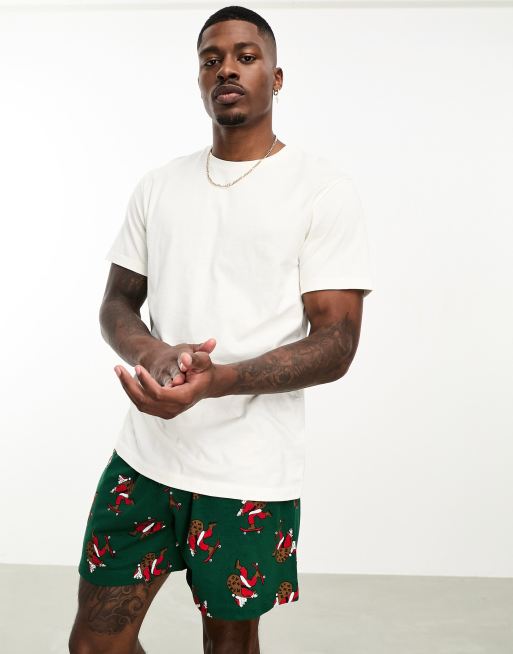 ASOS DESIGN - Pyjamaset van T-shirt en short met kerstmanprint in groen