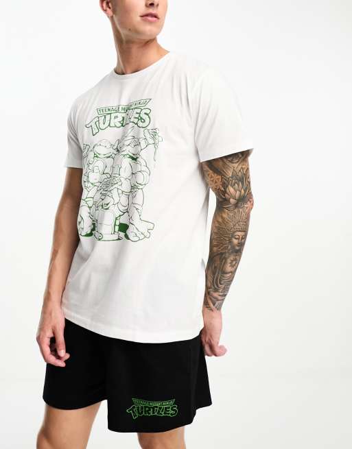 ASOS DESIGN - Pyjamaset van T-shirt en short met Ninja Turtles print in zwart met wit