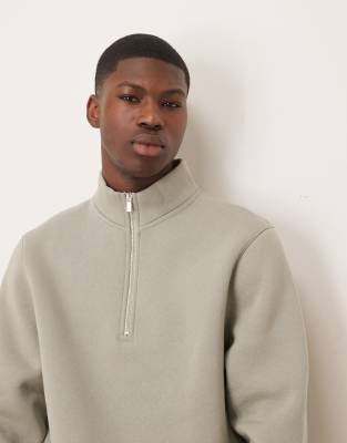 ASOS DESIGN quarter zip sweatshirt in sage-White
