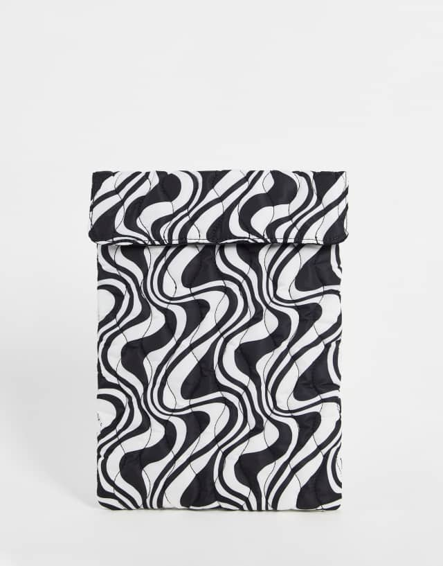 ASOS DESIGN quilted laptop sleeve in mono swirl print