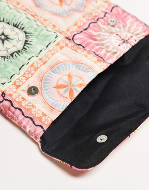 ASOS DESIGN quilted laptop sleeve in patchwork print