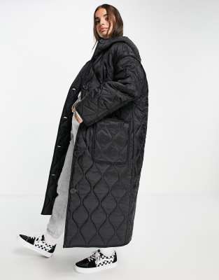 ASOS DESIGN longline puffer jacket in black monogram print