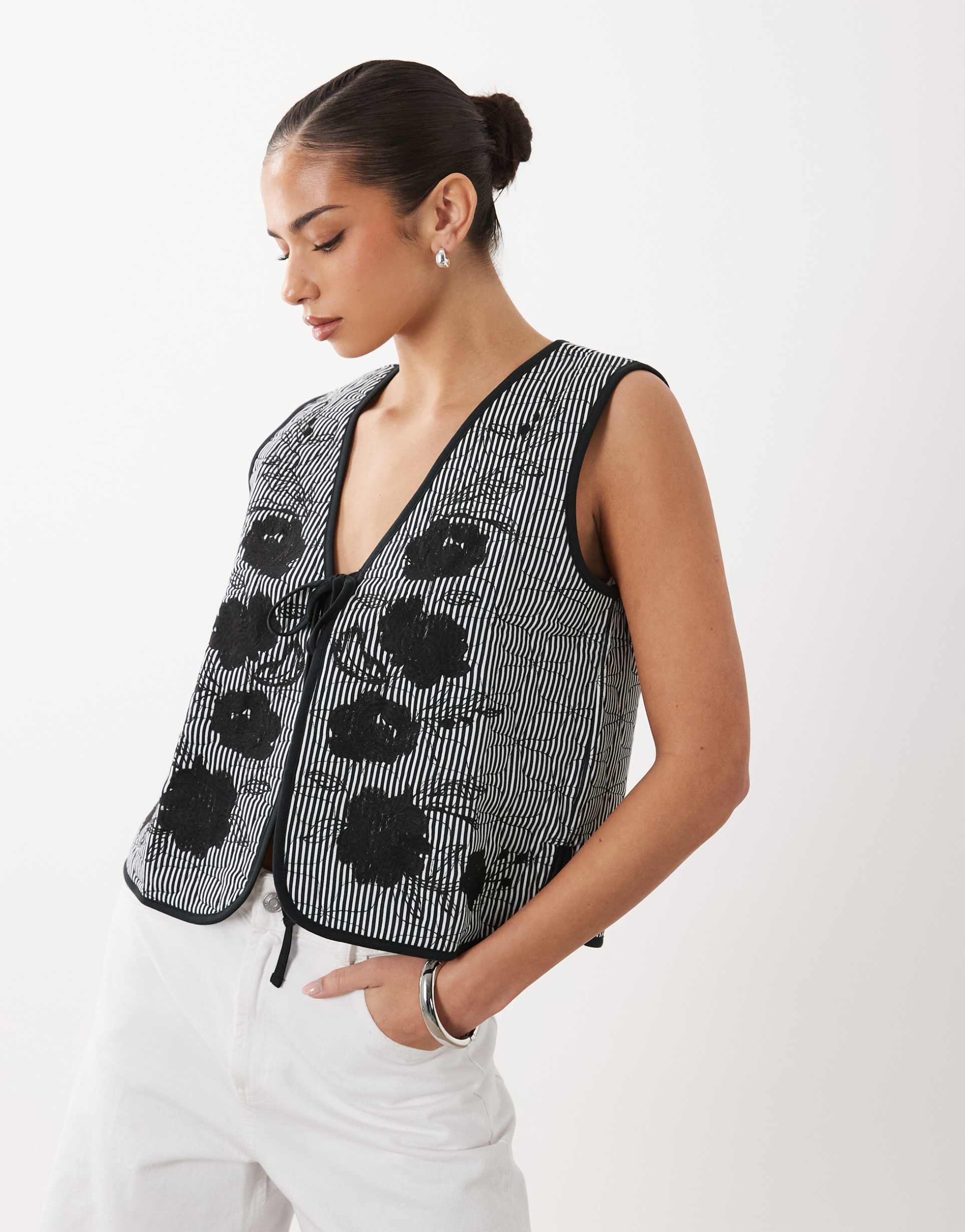 asos design quilted striped vest with embroidered floral design in black and white