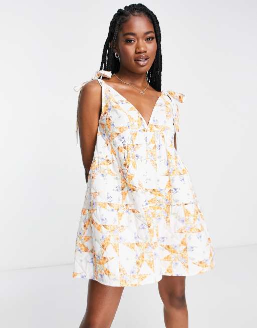 ASOS DESIGN quilted tie shoulder smock playsuit in mixed floral print ...