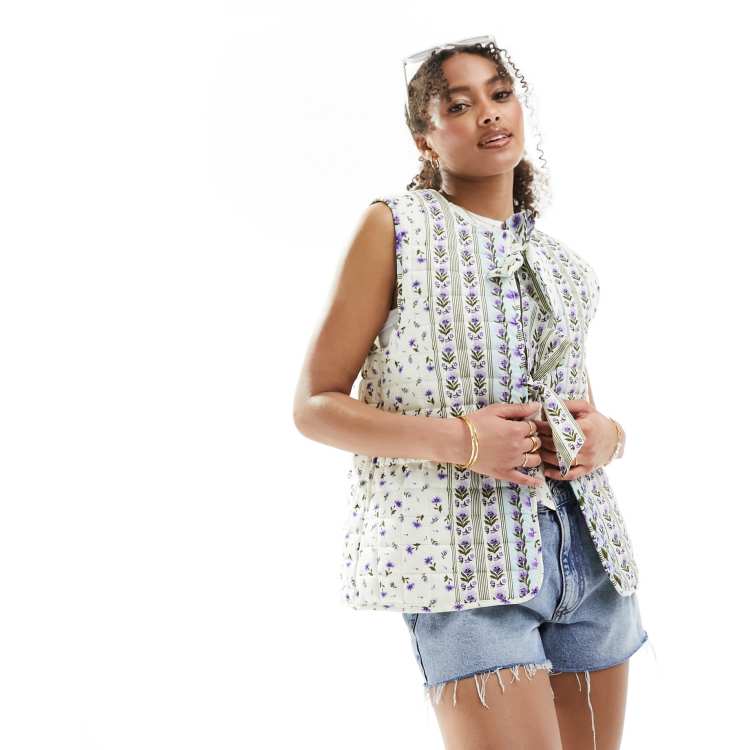 ASOS DESIGN quilted vest with bows in white | ASOS