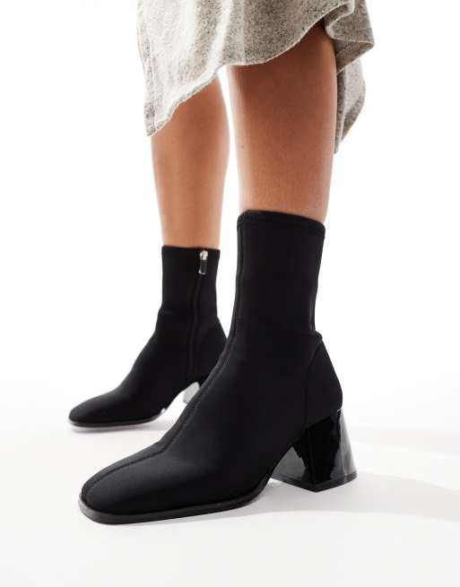 ASOS DESIGN Radiant flared block heel boots in black neoprene