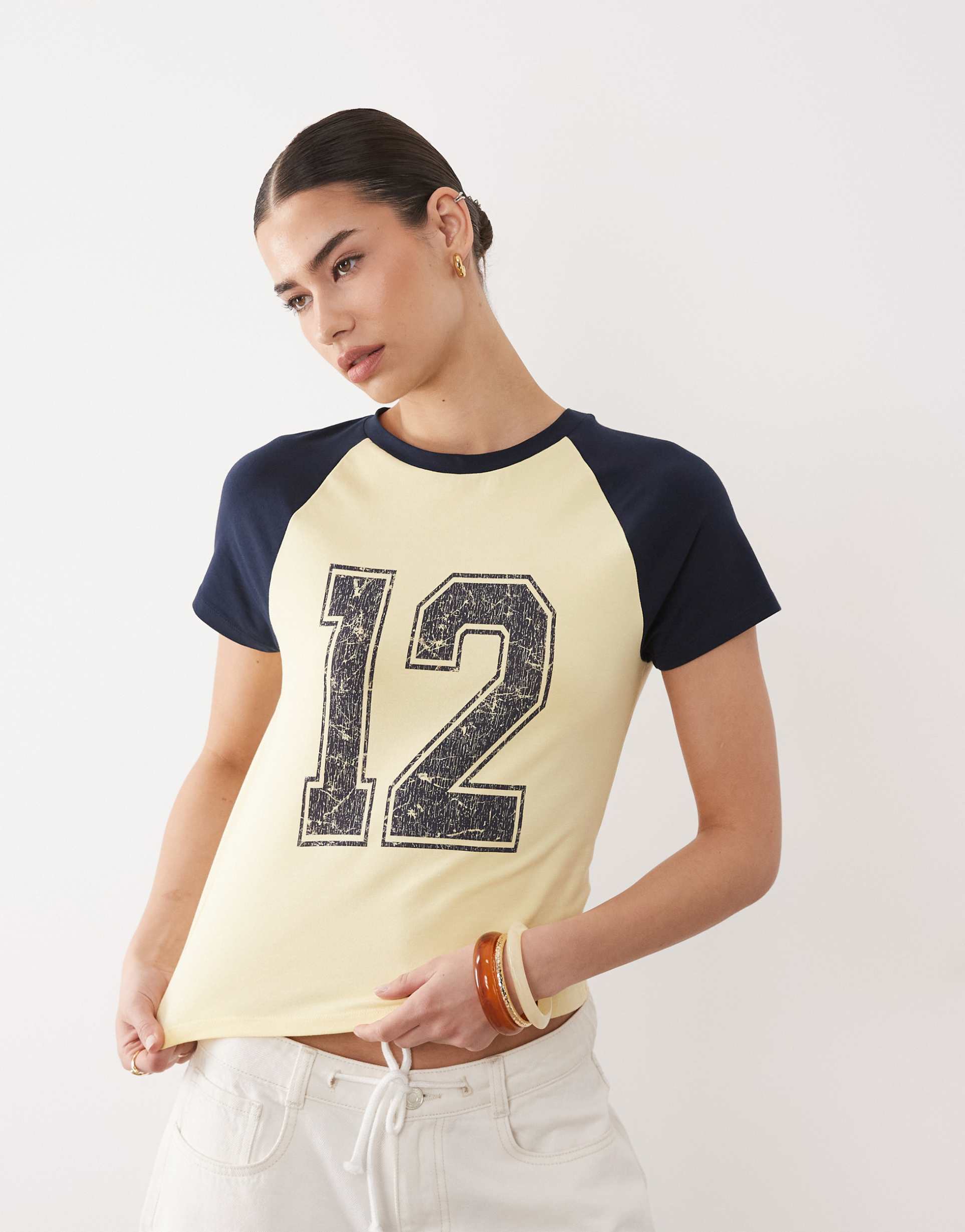 asos design raglan sleeve baby tee with distressed 12 graphic in buttermilk and navy